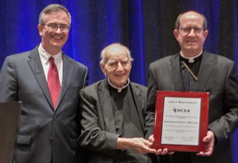 Bishop receiving NCEA award