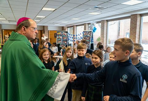 Bishop Walkowiak with students