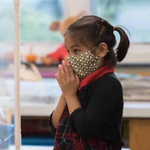A student prays.